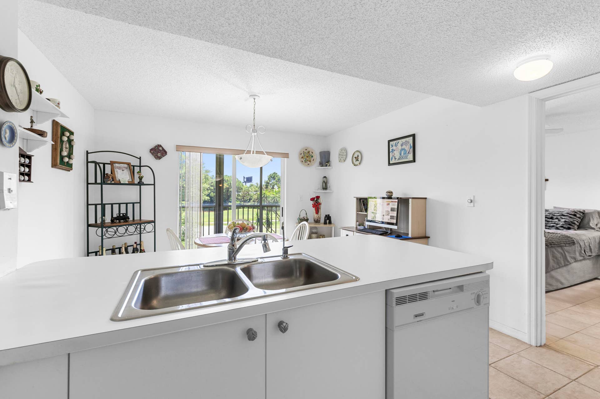 Kitchen opens up to eat-in dining (or office nook) w/ views of golf