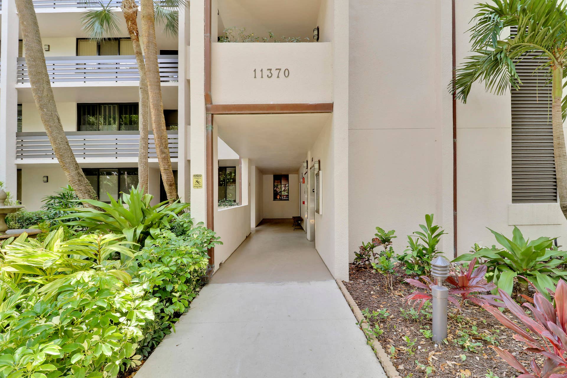 11370 Twelve Oaks Way, #416, North Palm Beach, FL 33408 Walkway to Elevator