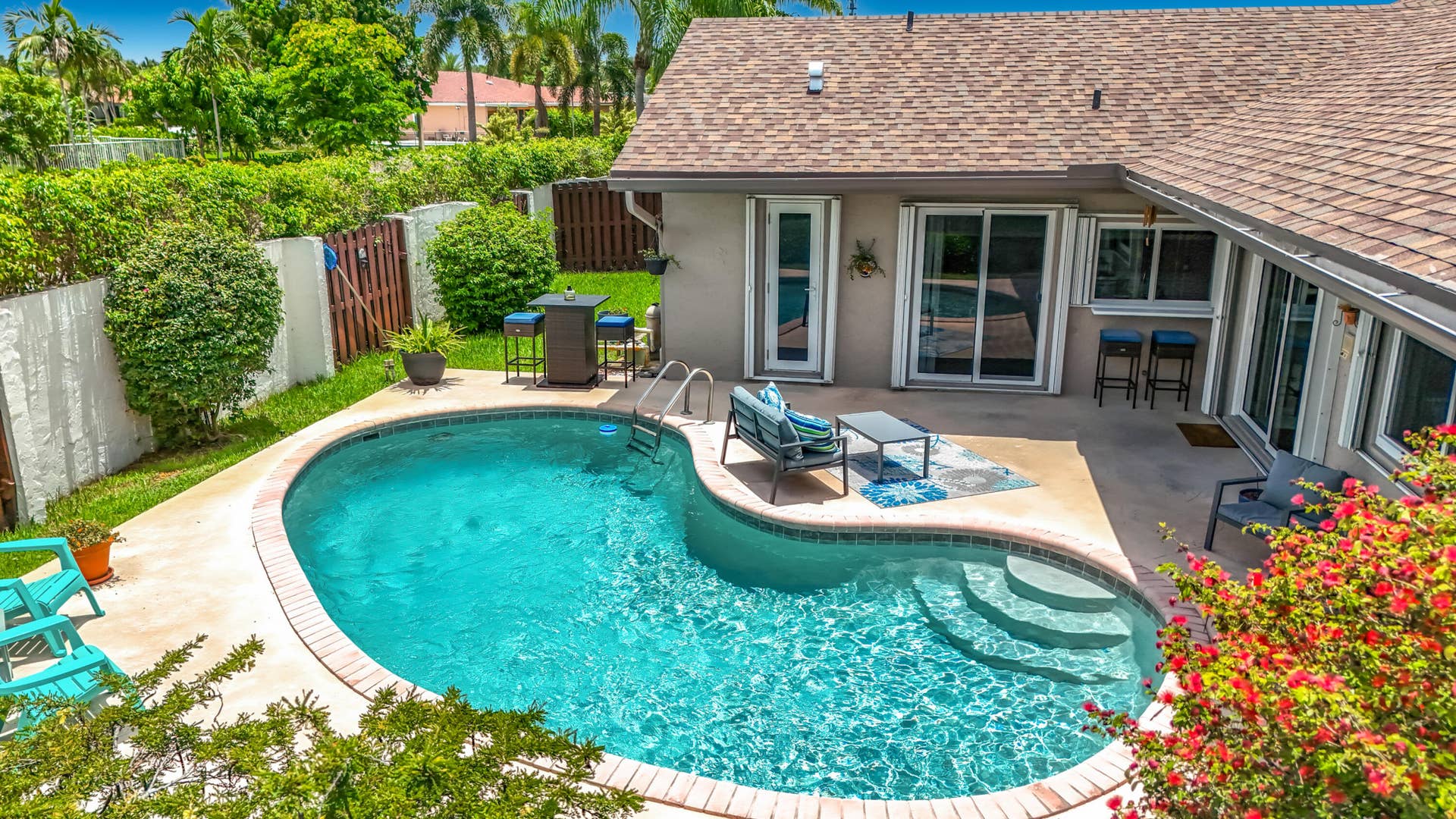 16751 Redwood Way, Weston, FL 33326 Aeriel of pool area and home with shutters and all impact