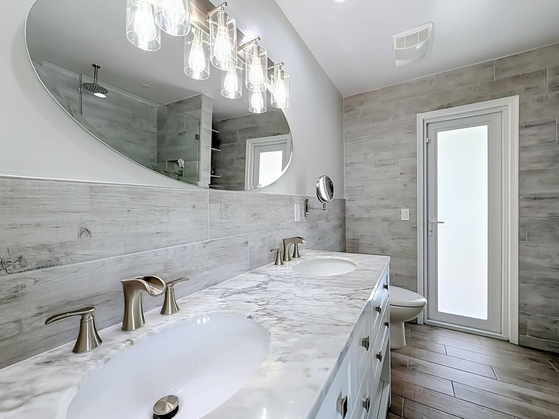 16751 Redwood Way, Weston, FL 33326 Primary bathroom with dual sinks out to pool