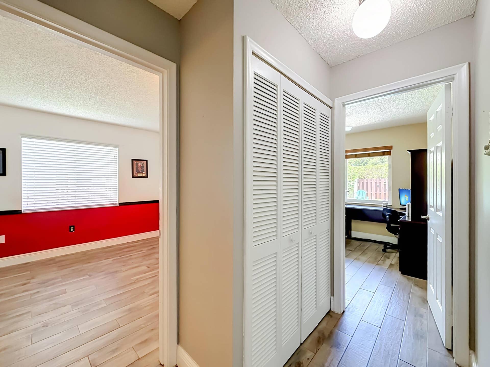 16751 Redwood Way, Weston, FL 33326 Hallway to 2nd split, View of bedroom 3 Heat decor and 2nd office decor with view of pool area