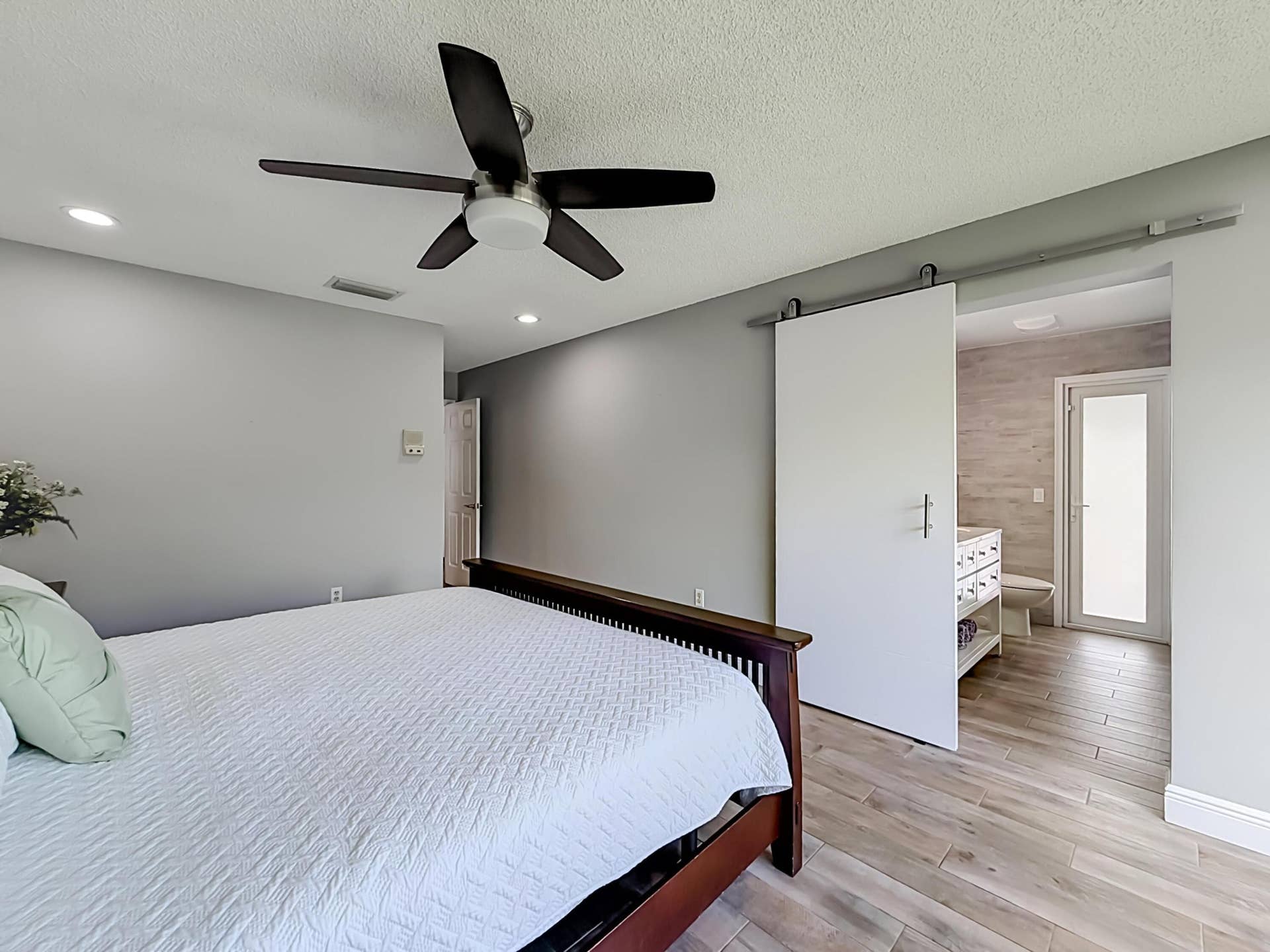 16751 Redwood Way, Weston, FL 33326 Primary with sliding door to remodeled bathroom