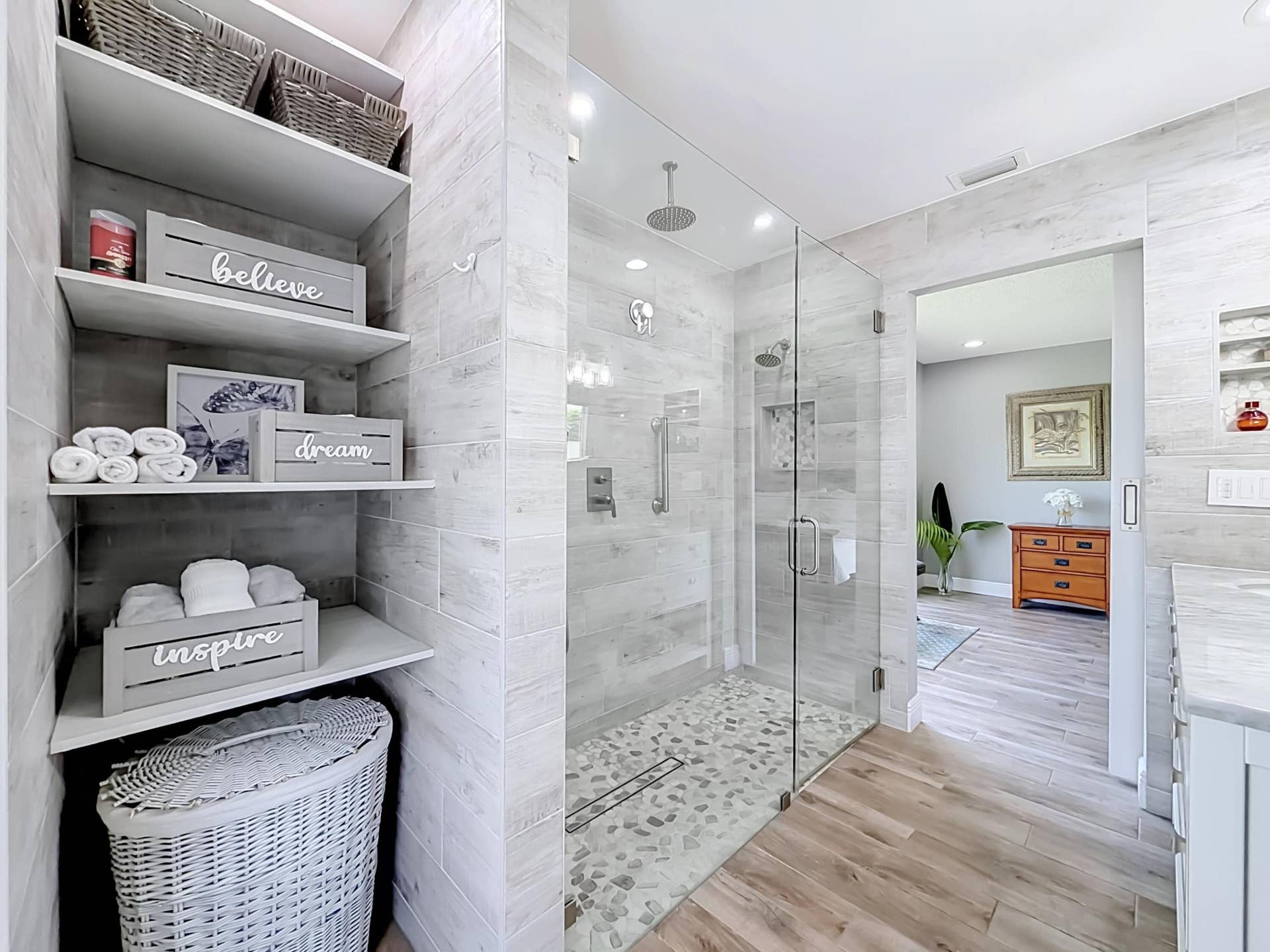 16751 Redwood Way, Weston, FL 33326 Primary shelving with shower view of bedroom