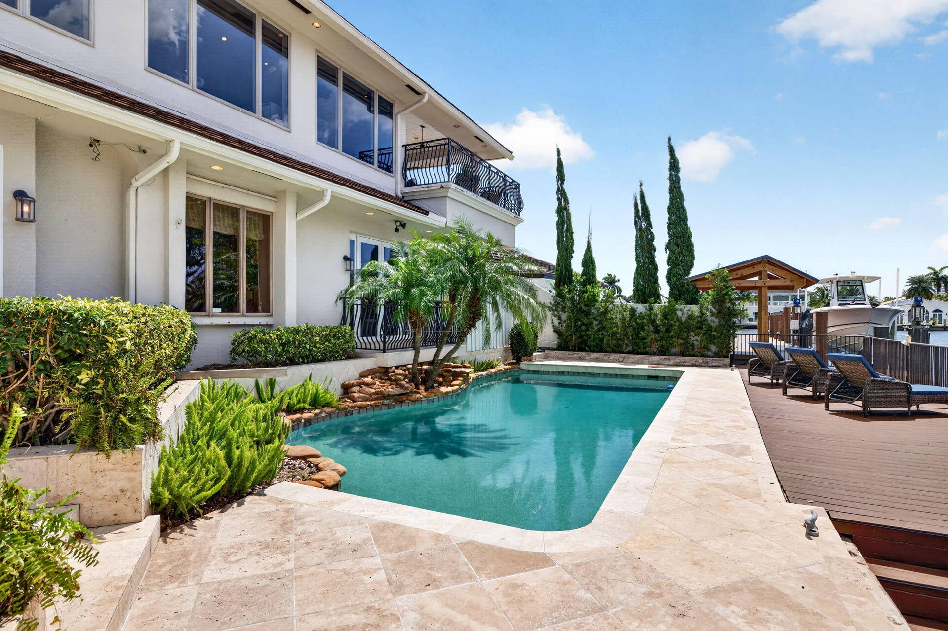 3110 NE 47th Street, Fort Lauderdale, FL 33308 The pool deck showcases the rear elevation, outdoor living space, and direct connection to the water.