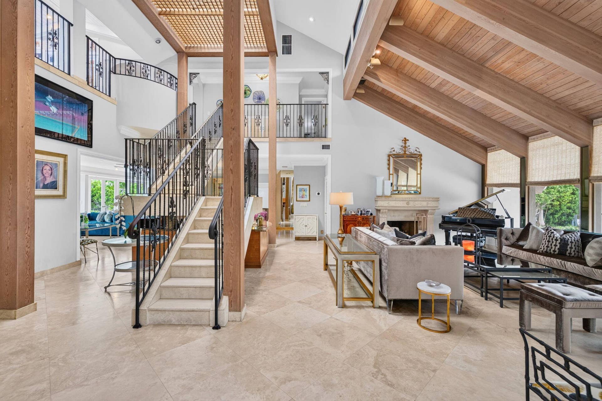 3110 NE 47th Street, Fort Lauderdale, FL 33308 A double-height living room creates an impressive first impression with volume, natural light, and a sculptural staircase.