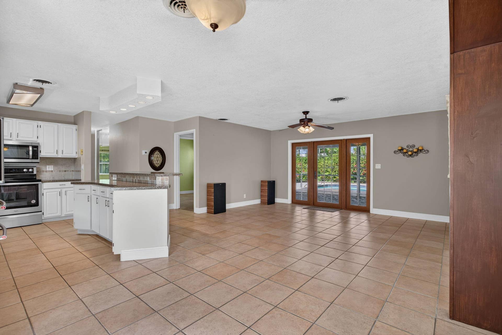 4931 NE 27th Avenue, Lighthouse Point, FL 33064 Open floor plan with kitchen island.