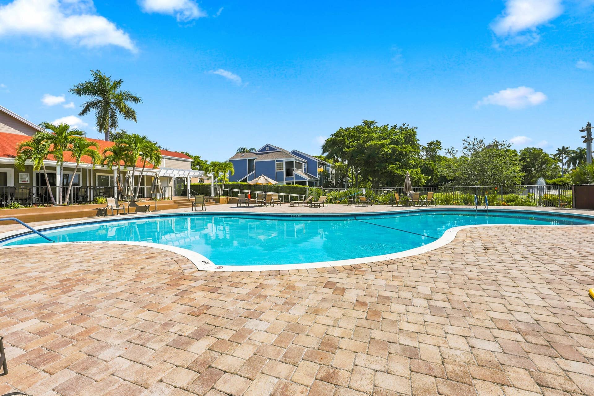 5266 Sapphire Valley, Boca Raton, FL 33486 Resort style community pool surrounded by lush tropical landscaping, offering the perfect place to relax, soak up the South Florida sunshine, or unwind after a day on the course.
