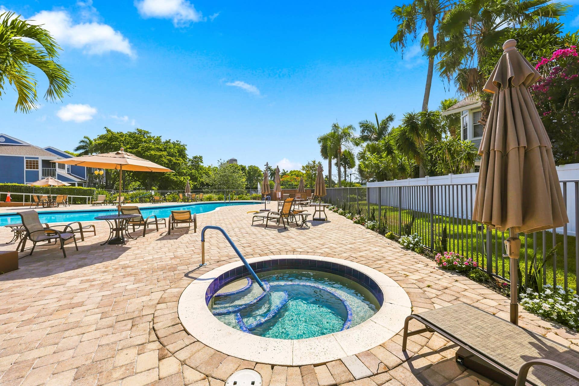 5266 Sapphire Valley, Boca Raton, FL 33486 Resort style community pool surrounded by lush tropical landscaping, offering the perfect place to relax, soak up the South Florida sunshine, or unwind after a day on the course.