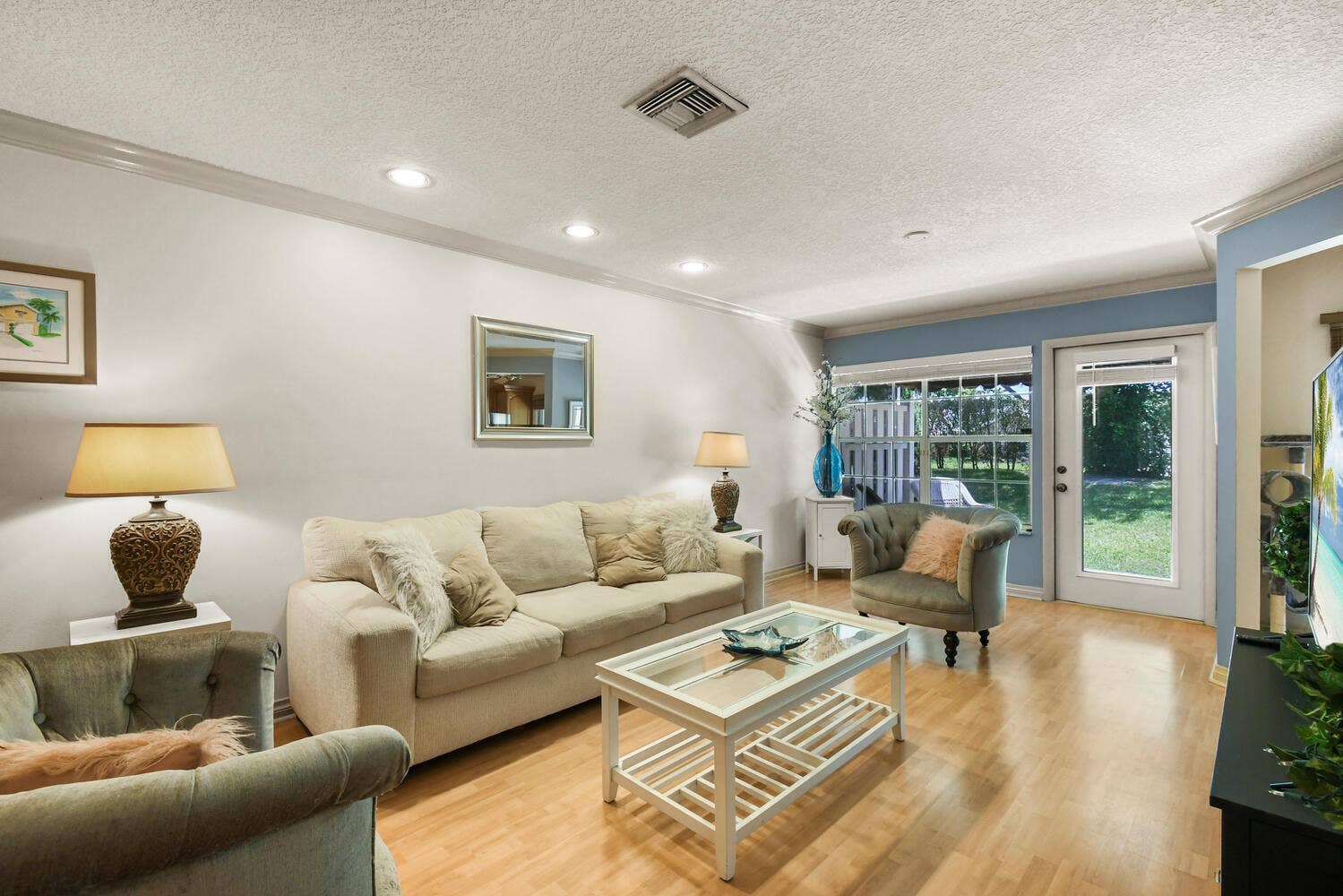 5266 Sapphire Valley, Boca Raton, FL 33486 Spacious family room filled with natural light, featuring recessed lighting, generous living space, and large windows overlooking the private backyard. The inviting layout flows seamlessly to the patio and outdoor living area, creating the perfect setting for relaxing or entertaining.