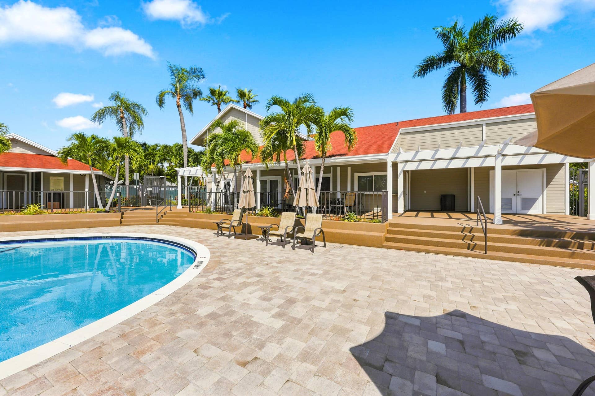 5266 Sapphire Valley, Boca Raton, FL 33486 Resort style community pool surrounded by lush tropical landscaping, offering the perfect place to relax, soak up the South Florida sunshine, or unwind after a day on the course.