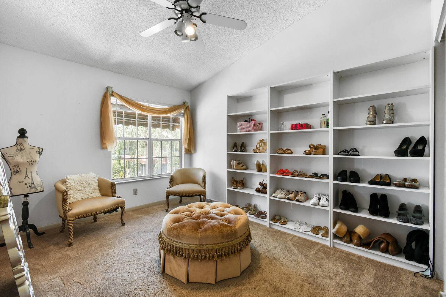 5266 Sapphire Valley, Boca Raton, FL 33486 An oversized third bedroom with vaulted ceilings and abundant natural light, offering exceptional flexibility for a guest suite, home office, nursery, fitness room, or dressing area. The generous layout provides plenty of space for furnishings, storage, and everyday functionality.