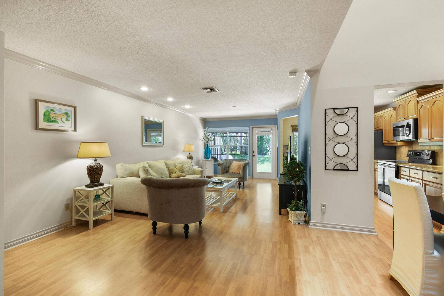 5266 Sapphire Valley, Boca Raton, FL 33486 Spacious family room filled with natural light, featuring recessed lighting, generous living space, and large windows overlooking the private backyard. The inviting layout flows seamlessly to the patio and outdoor living area, creating the perfect setting for relaxing or entertaining.
