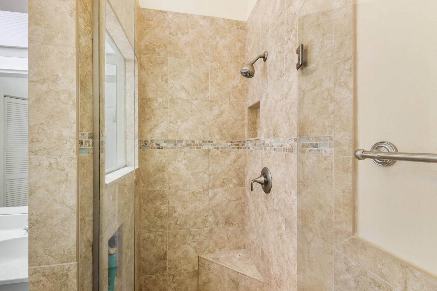 5266 Sapphire Valley, Boca Raton, FL 33486 Spacious ensuite bathroom featuring an oversized dual-sink vanity, abundant storage, a soaking tub, separate shower, and vaulted ceilings. Natural light and an open layout create a bright and relaxing retreat within the primary suite.