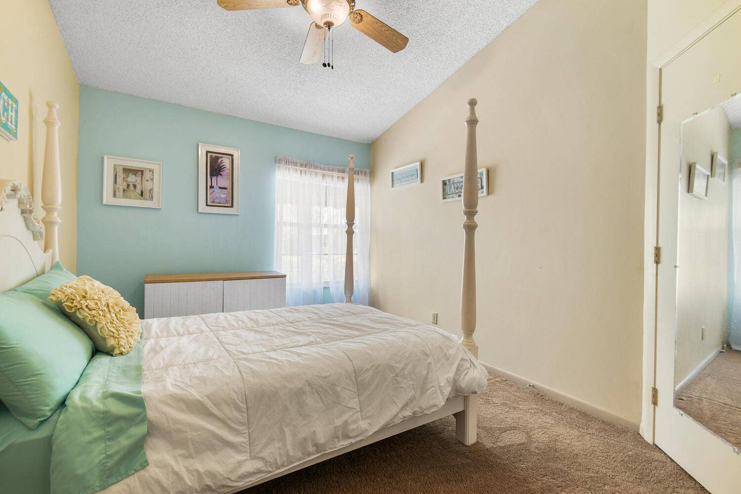 5266 Sapphire Valley, Boca Raton, FL 33486 Spacious guest bedroom featuring vaulted ceilings, abundant natural light, and a comfortable layout with ample closet space. A bright and inviting retreat for family or guests.