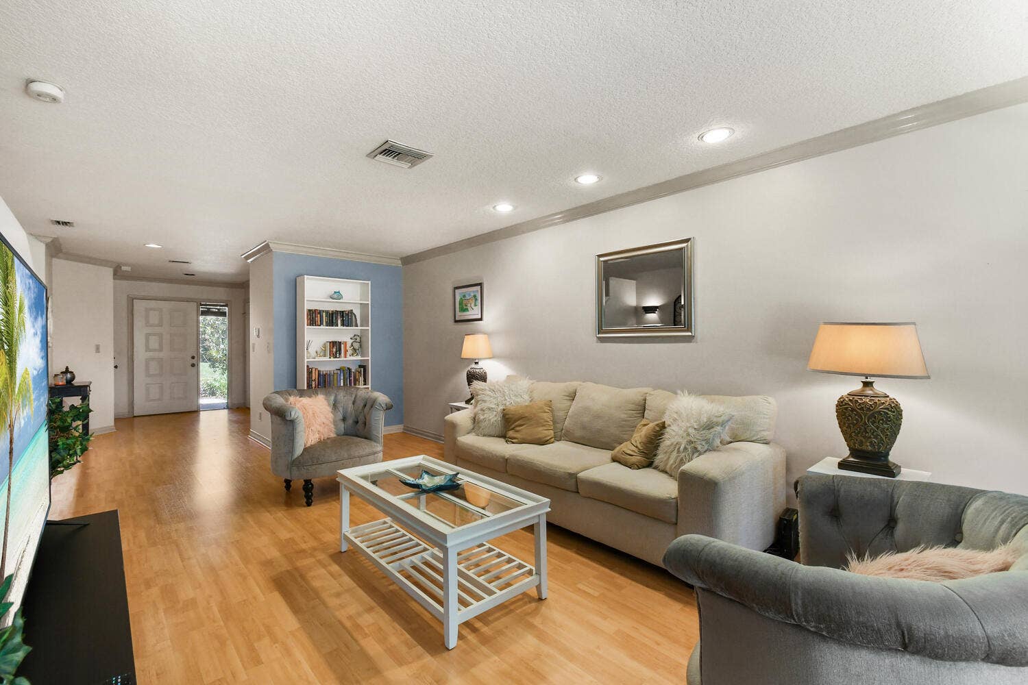 5266 Sapphire Valley, Boca Raton, FL 33486 Spacious family room filled with natural light, featuring recessed lighting, generous living space, and large windows overlooking the private backyard. The inviting layout flows seamlessly to the patio and outdoor living area, creating the perfect setting for relaxing or entertaining.