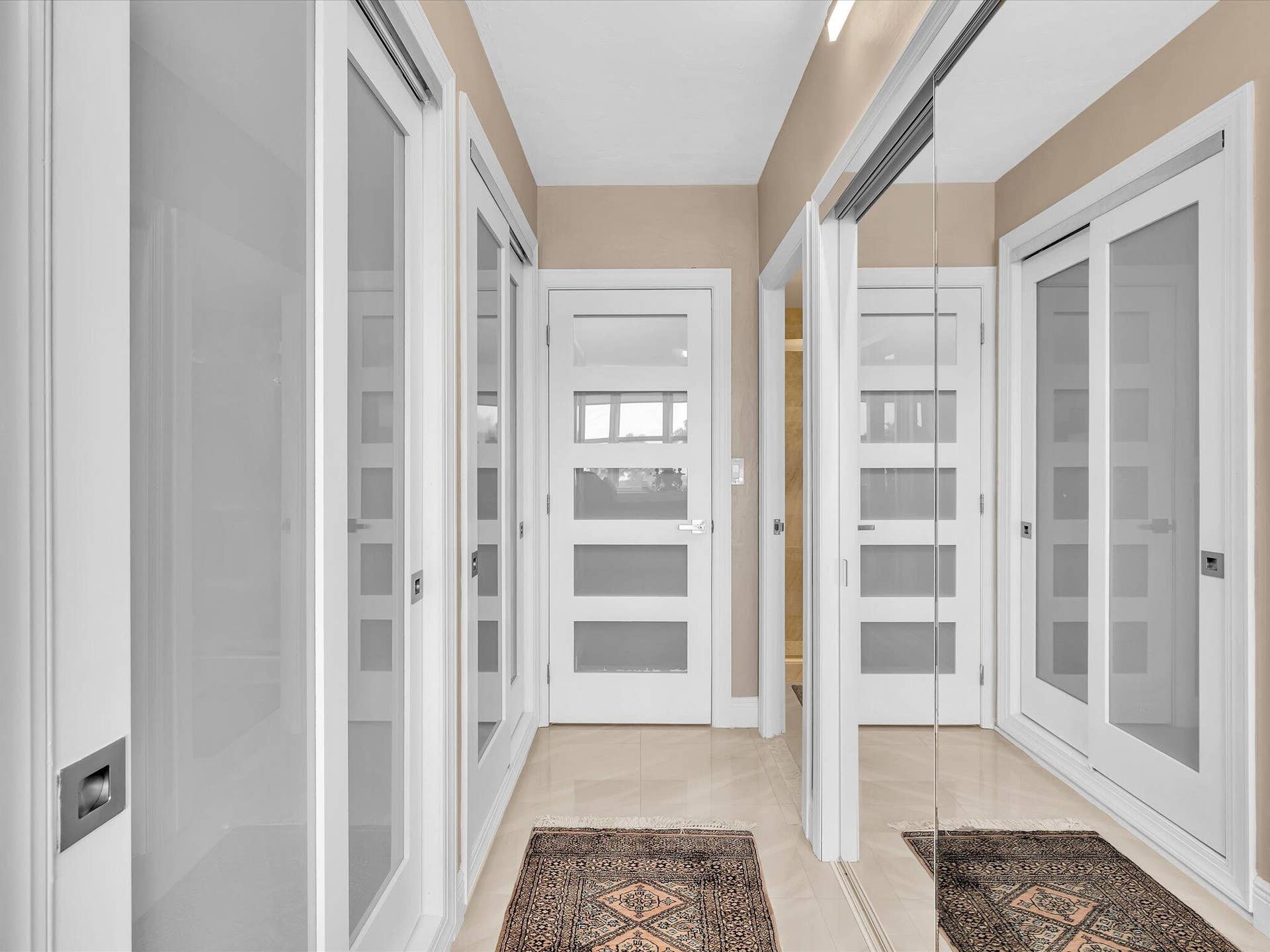 Closets flank the entry to ensuite bath