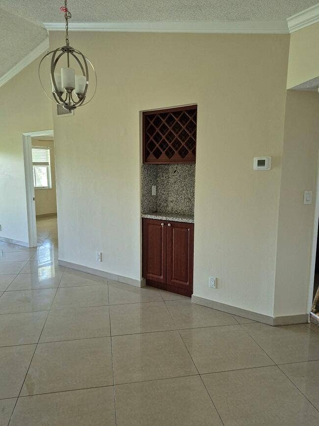 2823 N Course Drive, #205, Pompano Beach, Pompano Beach, FL 33069 Dining Area with WIne Rack