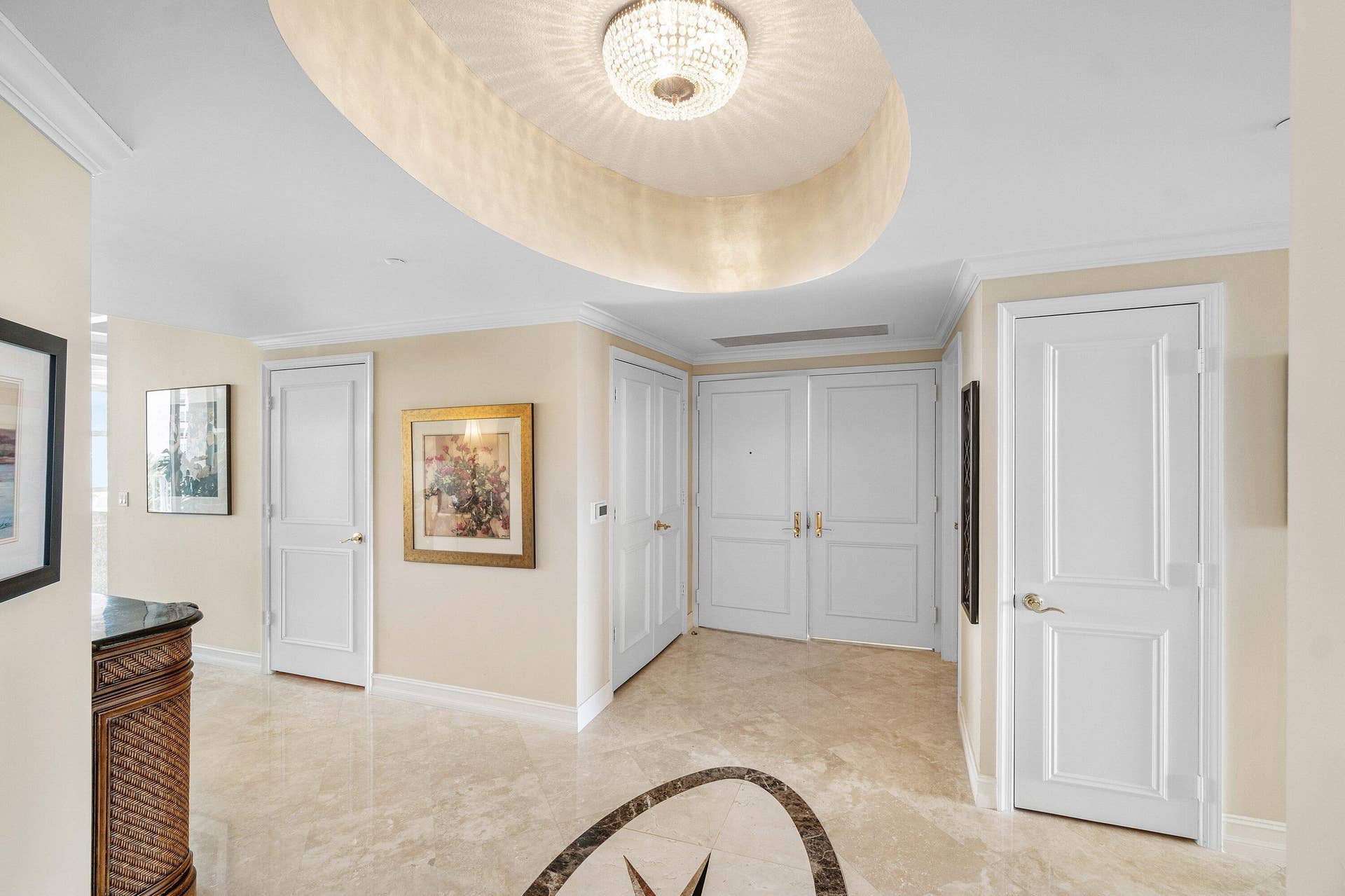 A DOUBLE DOOR ENTRANCE INTO YOUR GRAND FOYER
