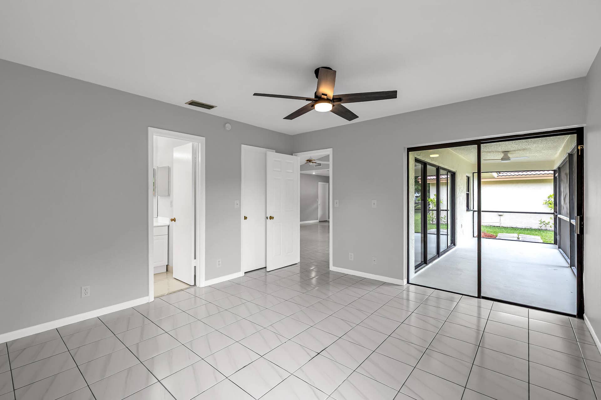 PRIMARY BEDROOM- Access to patio. Walk in closet.