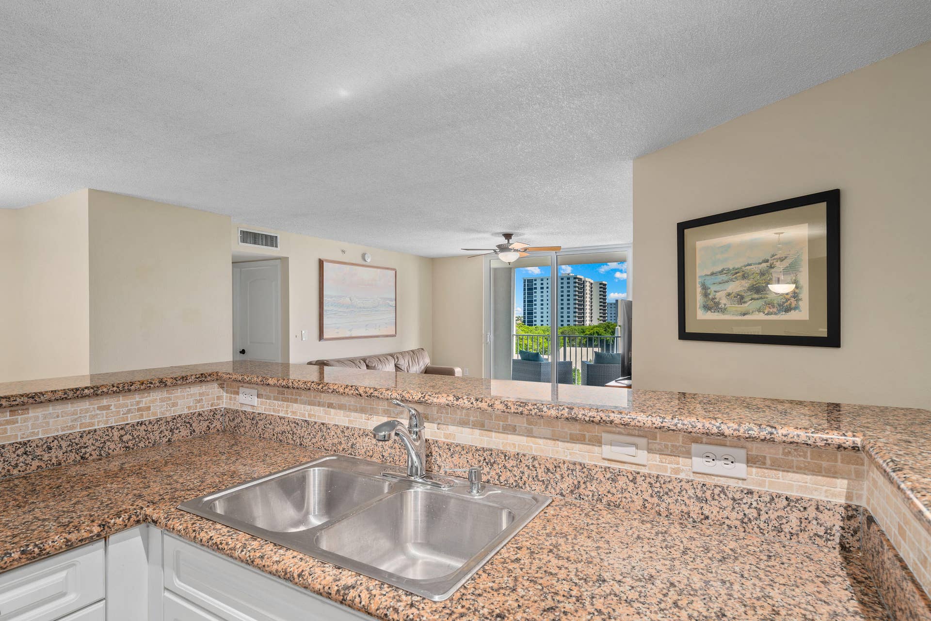 3594 S Ocean Boulevard, #604, Highland Beach, FL 33487 Open kitchen with countertop seating