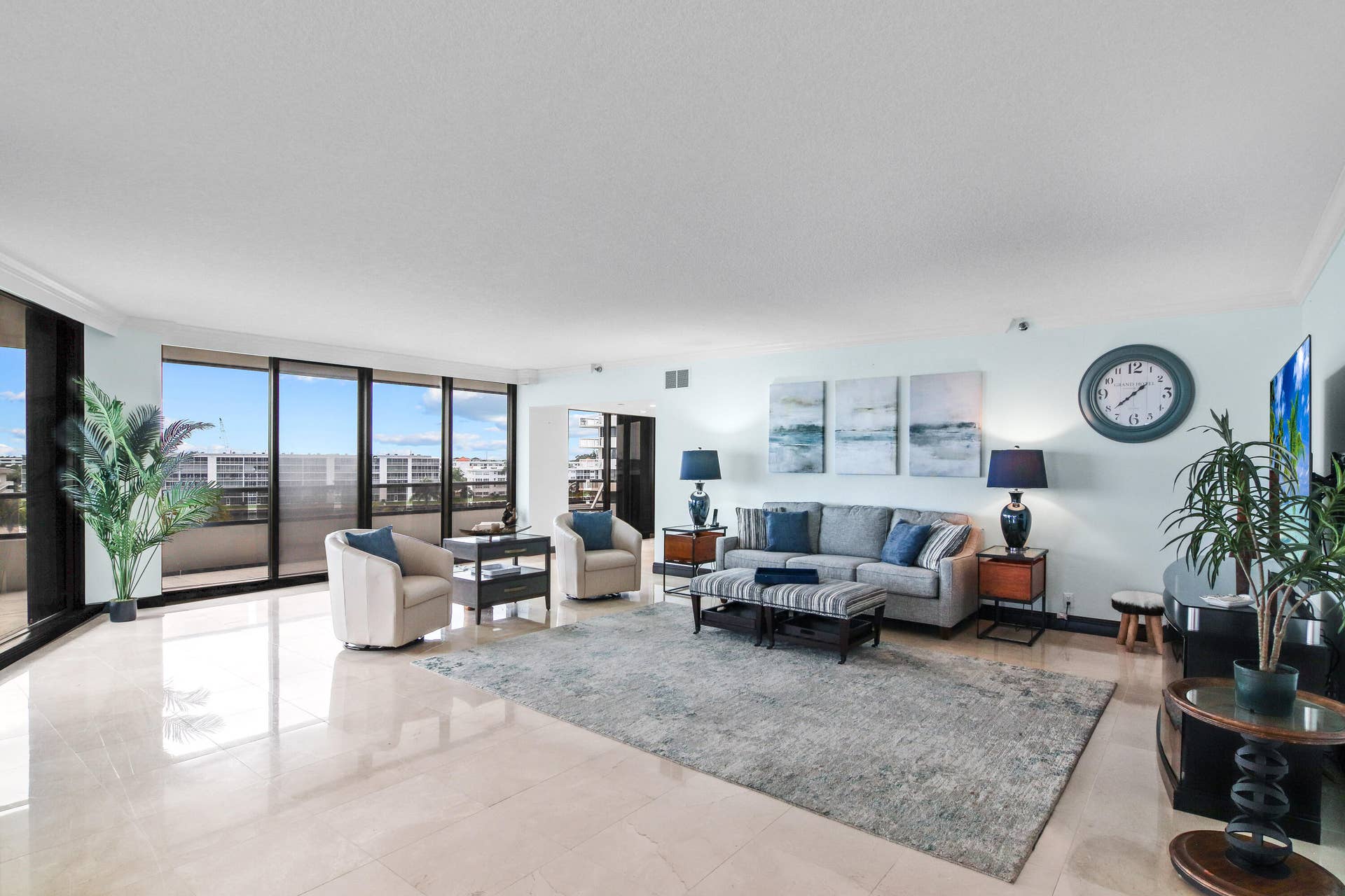 100 Lakeshore Drive, #458, North Palm Beach, FL 33408 Living Room 1 - All sliders have electric shades.