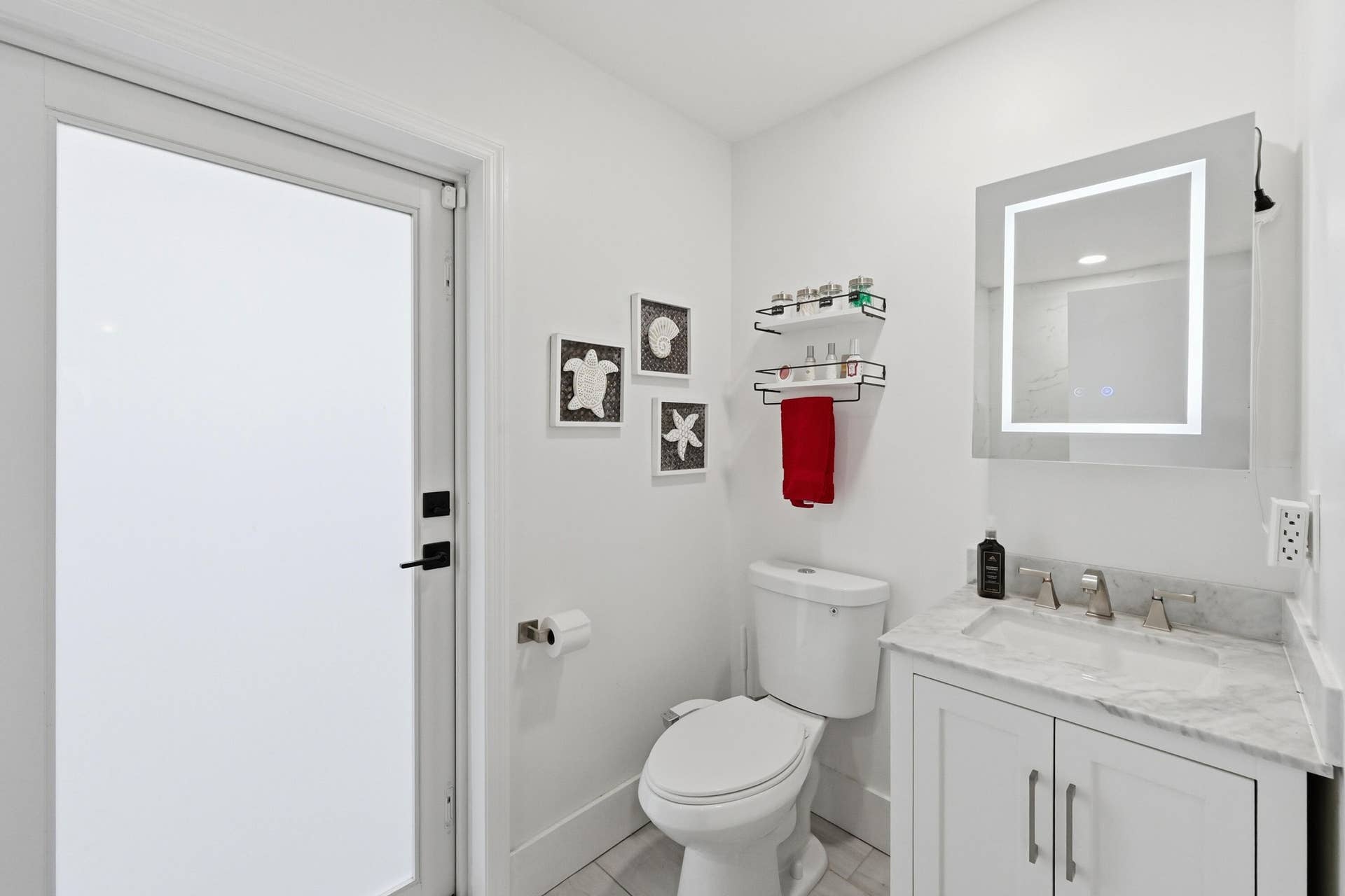 141 SE 8th Street, Pompano Beach, FL 33060 Beautifully renovated private bathroom offers comfort, style, and the convenience of an en suite retreat.