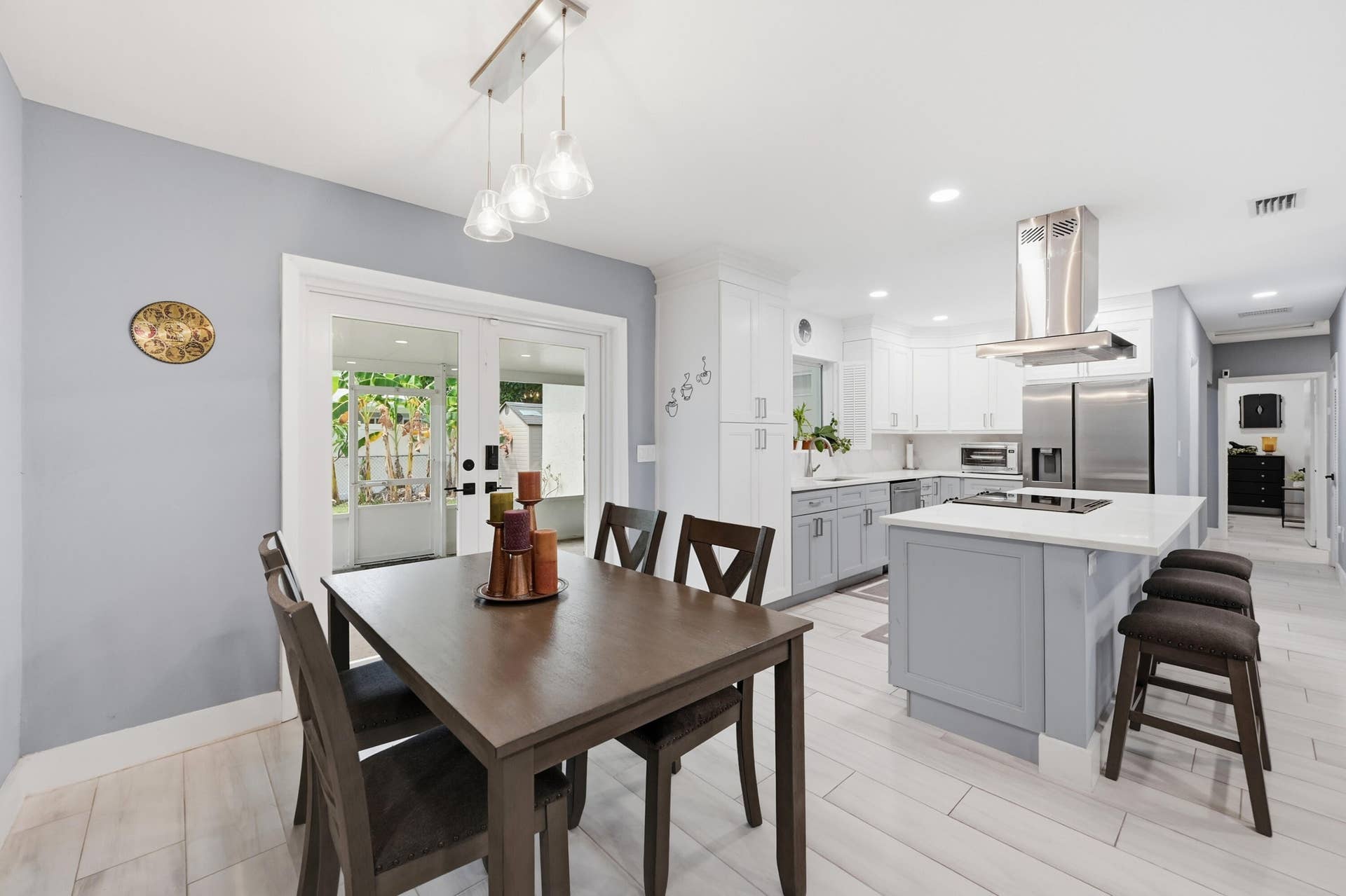 141 SE 8th Street, Pompano Beach, FL 33060 Thoughtfully designed spaces flow effortlessly from the kitchen to the dining area, making everyday living both comfortable and inviting.