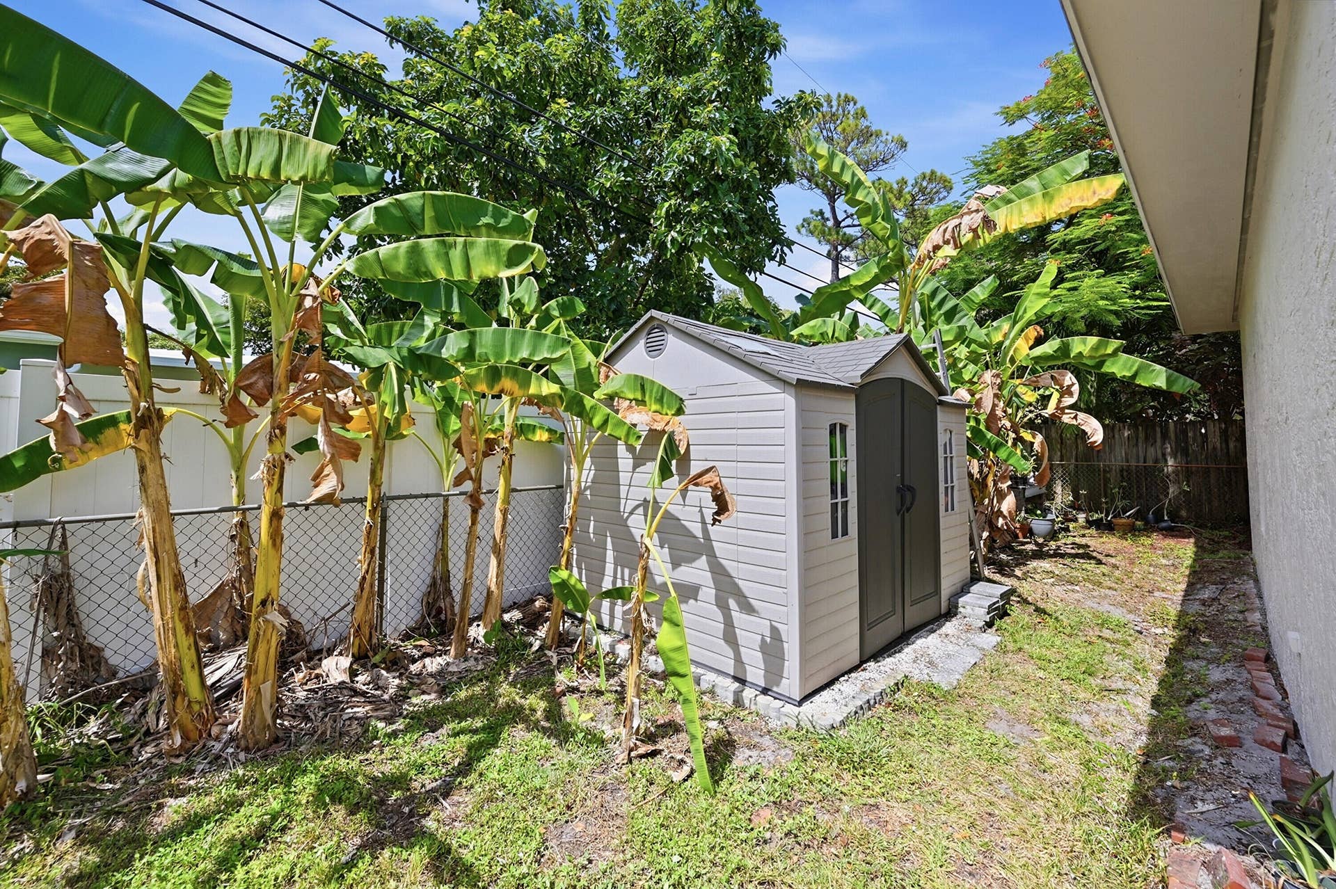 141 SE 8th Street, Pompano Beach, FL 33060 Backyard storage shed provides added convenience and extra space for tools, hobbies, and outdoor equipment.