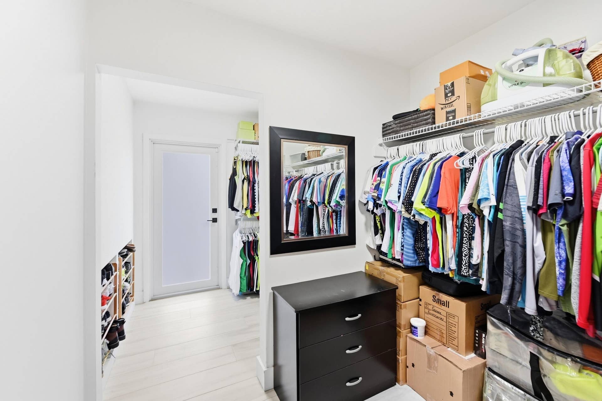 141 SE 8th Street, Pompano Beach, FL 33060 Expansive walk in closet offers exceptional storage and organization for your wardrobe and everyday essentials.