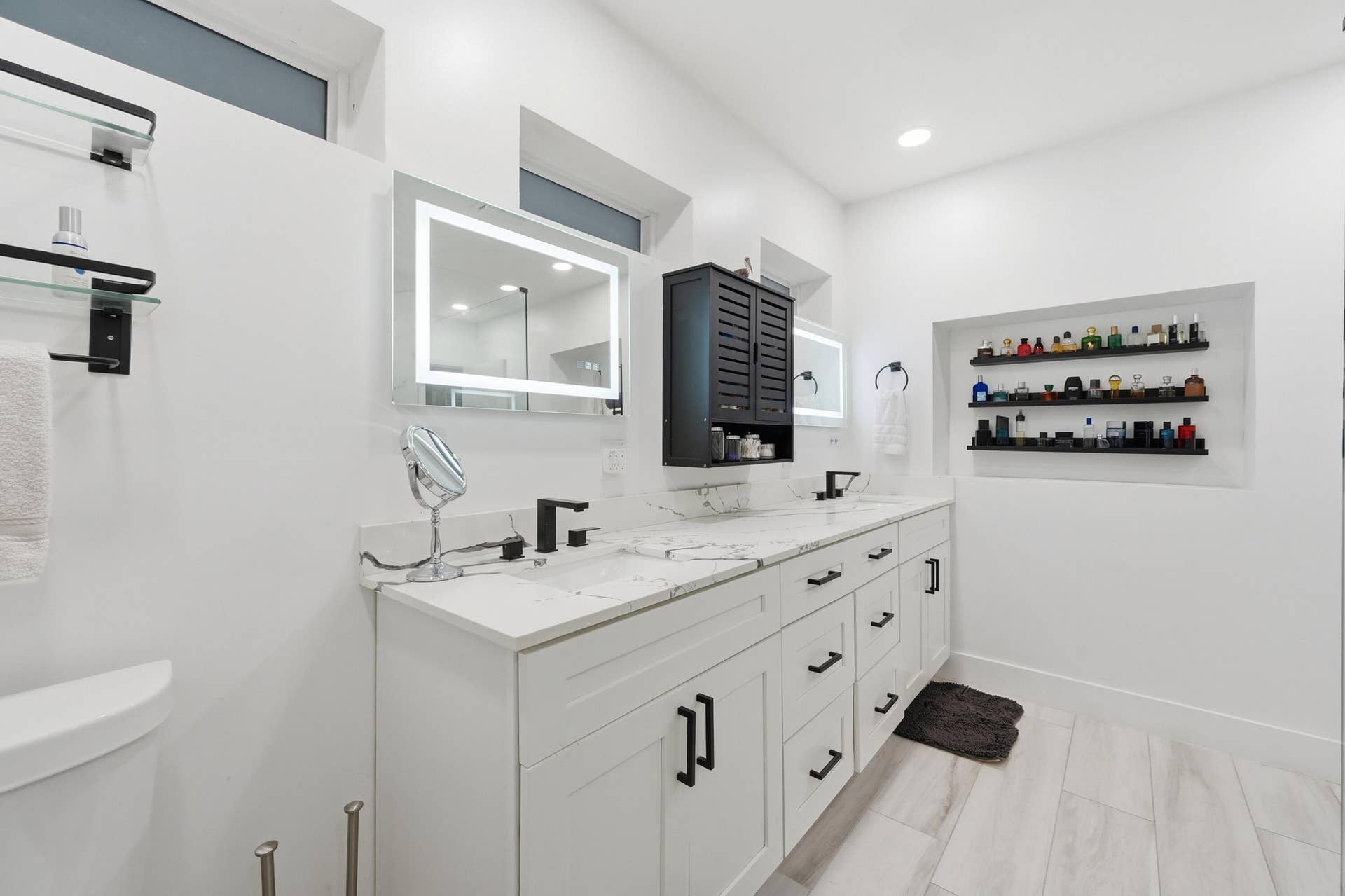 141 SE 8th Street, Pompano Beach, FL 33060 Beautifully renovated oversized primary bathroom offering the perfect blend of elegance, comfort, and modern design.