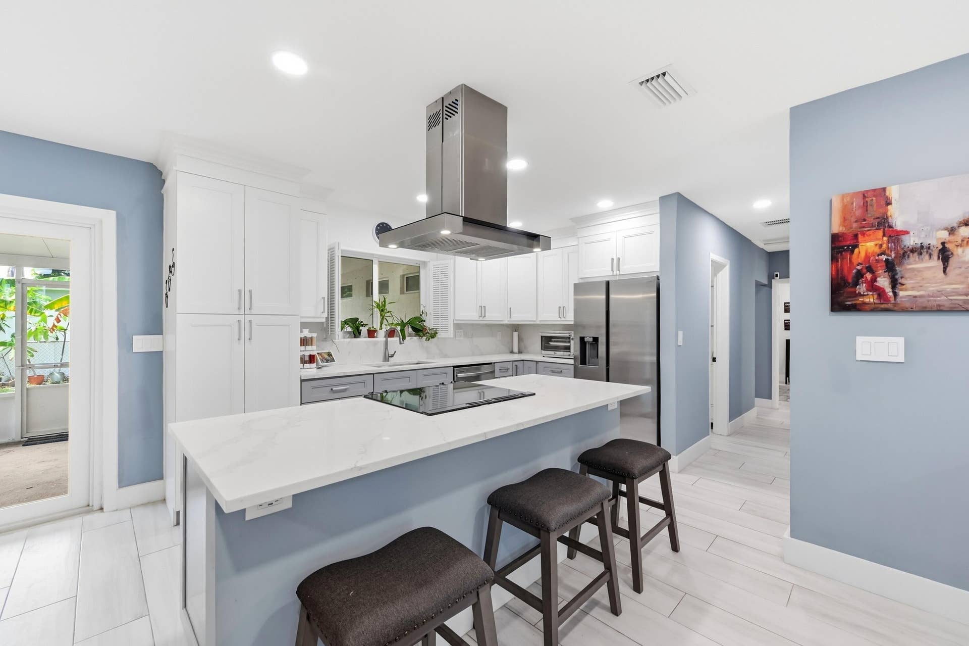 141 SE 8th Street, Pompano Beach, FL 33060 Abundant workspace, quality finishes, and thoughtful updates make this kitchen as practical as it is inviting.