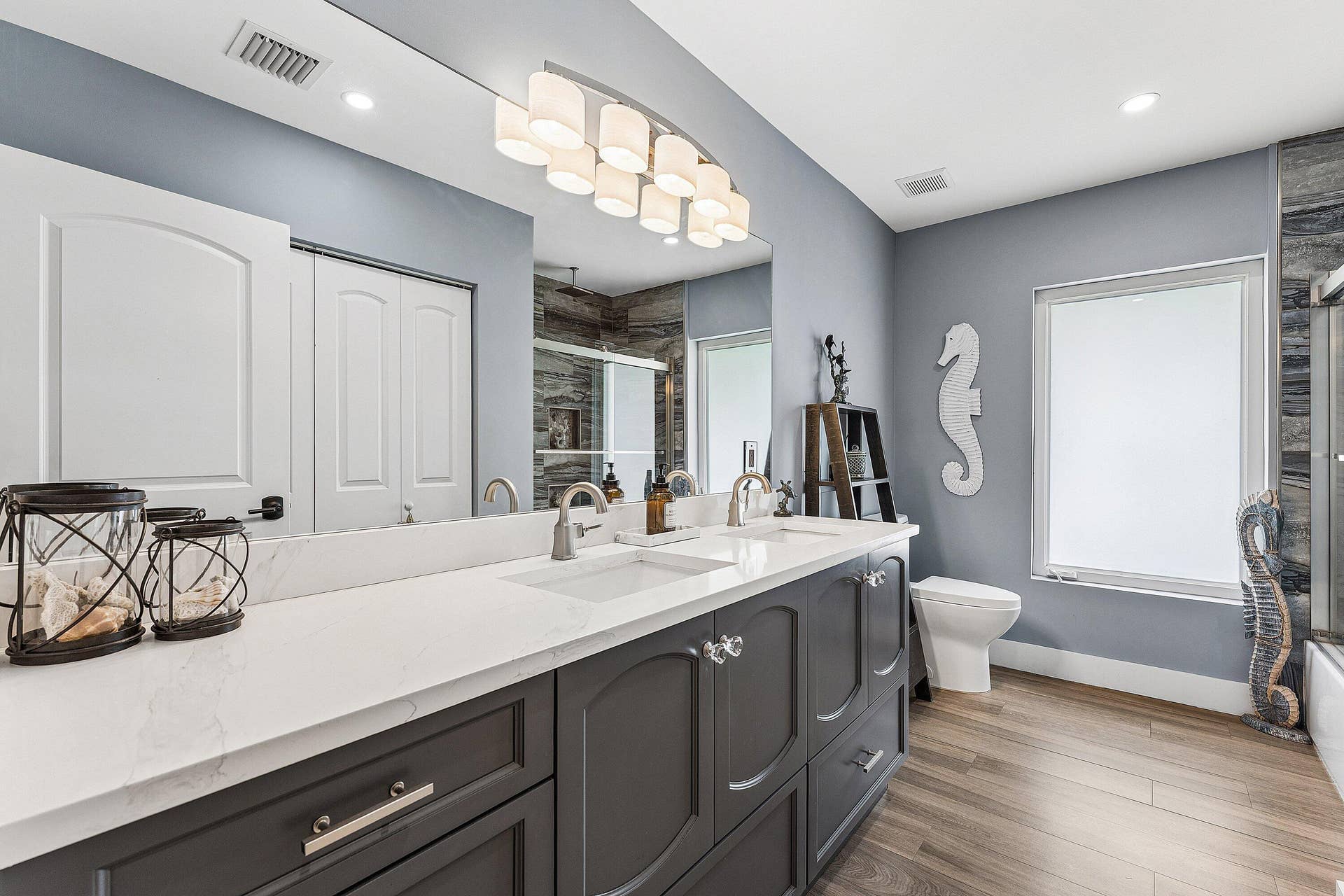 Main Hallway Bathroom with Dual Sinks & Large Linen Closet