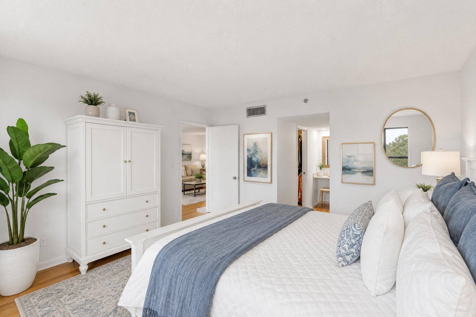 Virtually Staged. Start each day with serene golf course views from this oversized primary suite. The spacious bedroom offers a large walk-in closet, separate dressing vanity, and a renovated ensuite bathroom with a modern frameless glass shower, creating a peaceful retreat you'll look forward to coming home to.