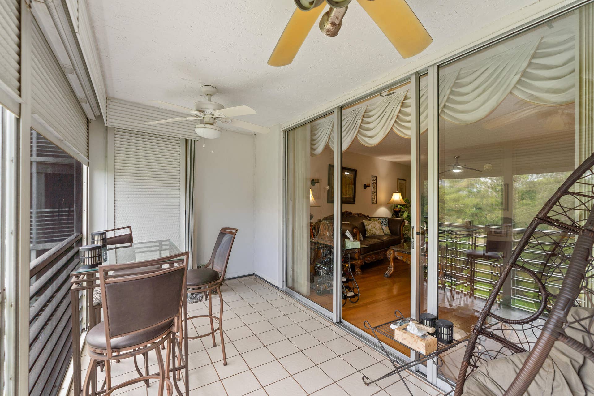 Enjoy year-round outdoor living from the spacious screened balcony overlooking the lush golf course and beautifully landscaped grounds.