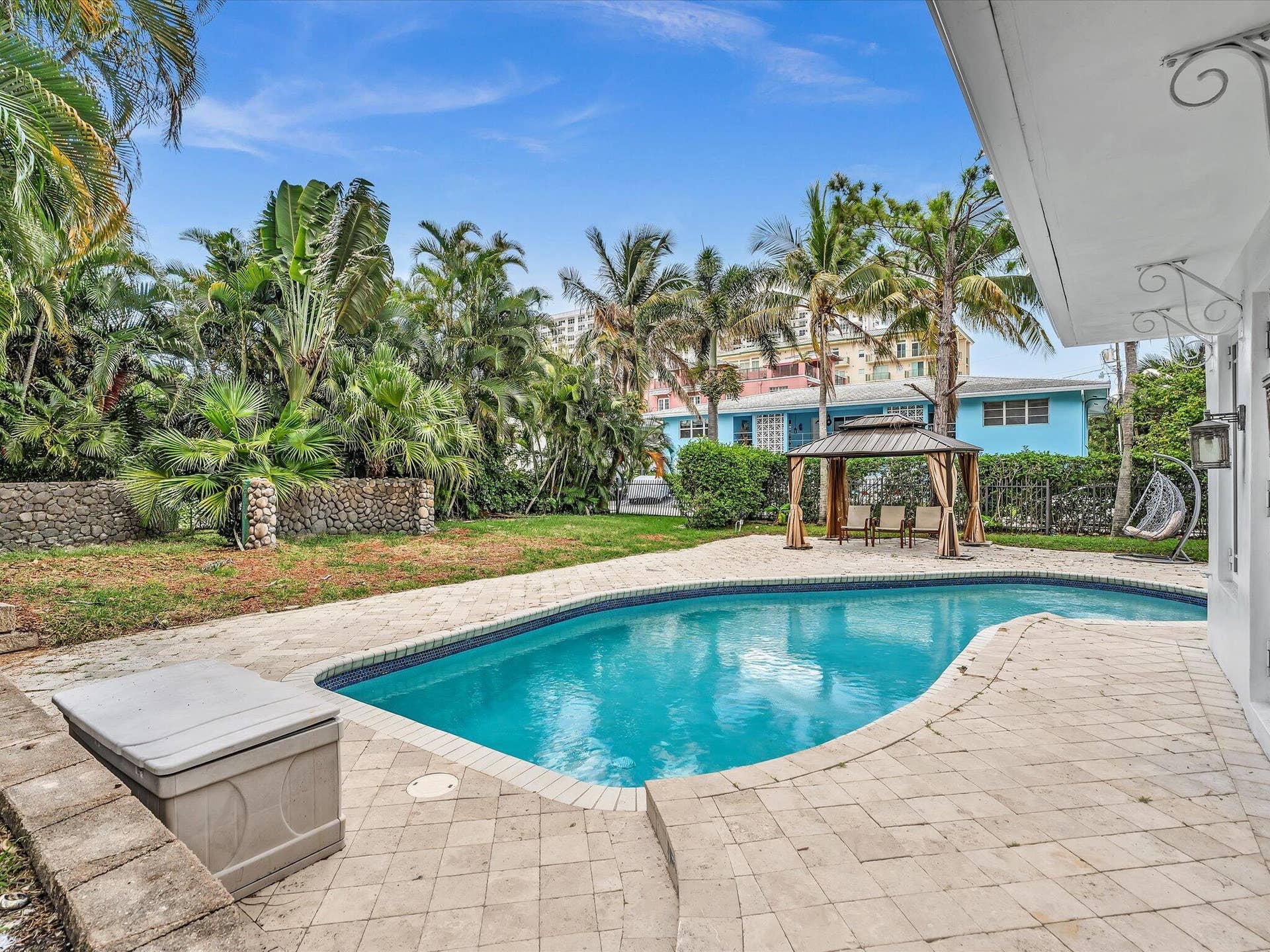 518 N Riverside Drive, Pompano Beach, FL 33062 Freeform swimming pool surrounded by paver decking