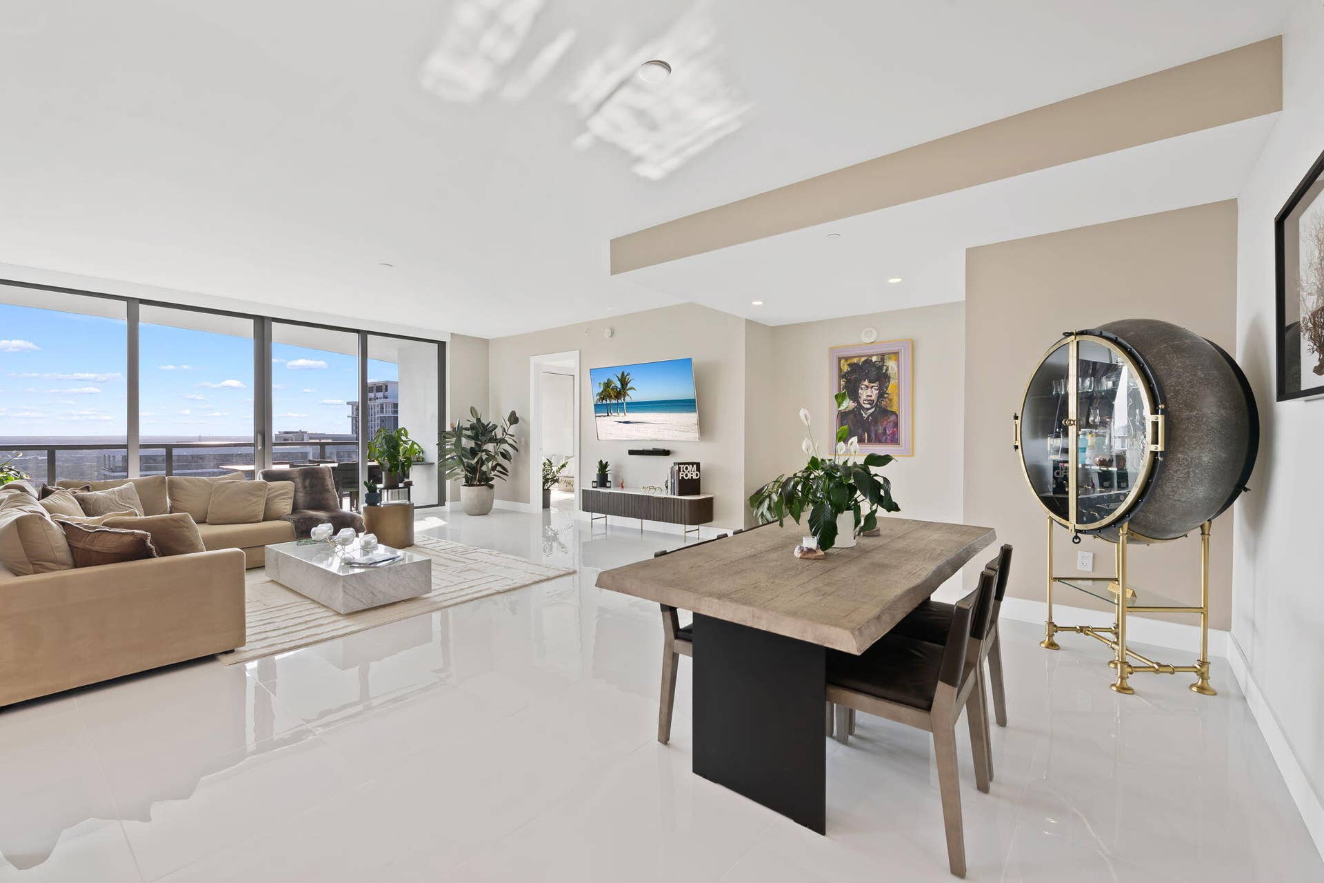 100 E Las Olas Boulevard, #3804, Fort Lauderdale, FL 33301 Spacious living area featuring expansive floor-to-ceiling windows, white tile flooring, and recessed lighting