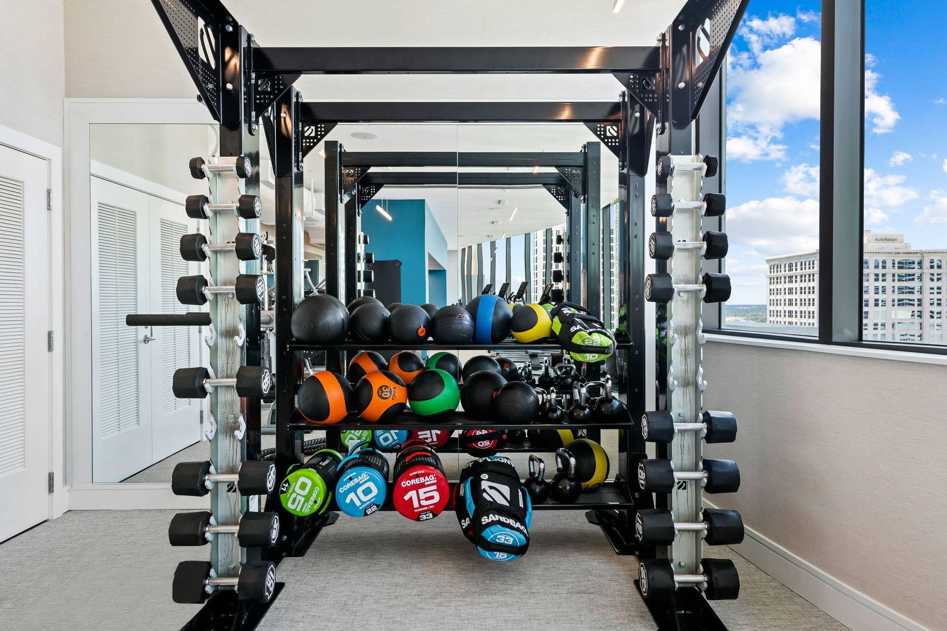 100 E Las Olas Boulevard, #3804, Fort Lauderdale, FL 33301 Fitness center featuring a comprehensive weight rack system with dumbbells and medicine balls