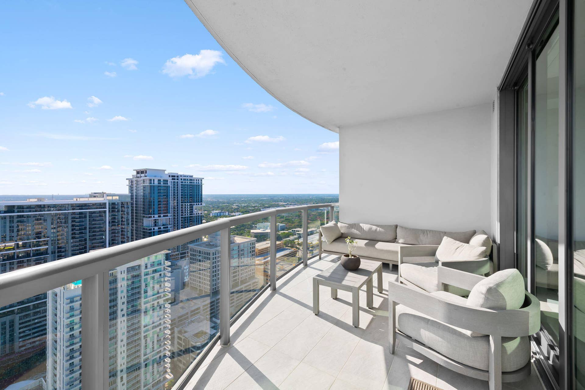 100 E Las Olas Boulevard, #3804, Fort Lauderdale, FL 33301 Expansive private balcony with a glass railing system and tile flooring