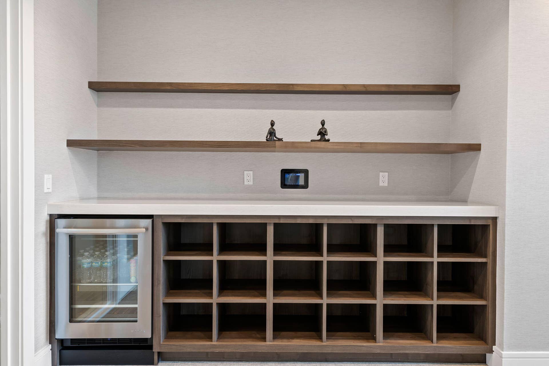 100 E Las Olas Boulevard, #3804, Fort Lauderdale, FL 33301 Built-in beverage station featuring a stainless steel refrigerator, white countertop, and integrated wood-finish shelving