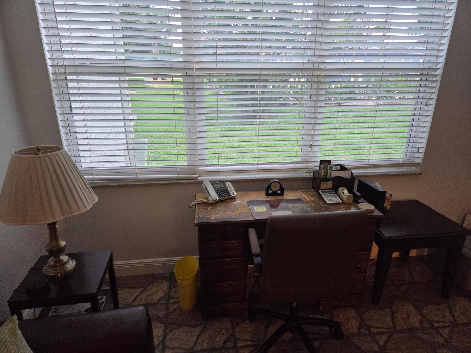Desk area and impact windows overlooking the swimming pool golf course and cookout area.