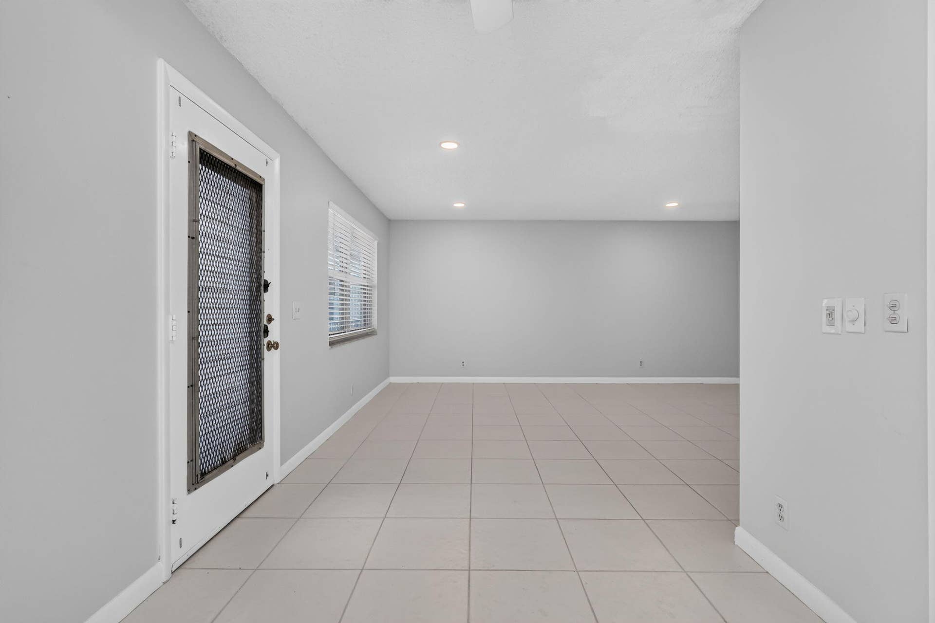 40 Burgundy A, Delray Beach, FL 33484 View of living room from kitchen