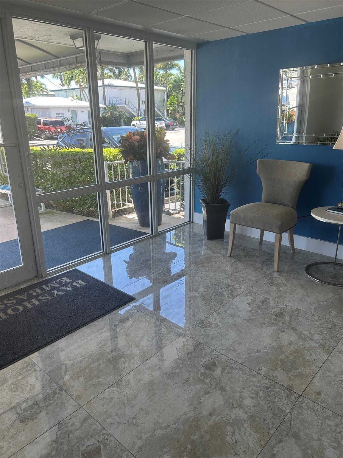 550 Bayshore Drive, #102, Fort Lauderdale, FL 33304 Canopy outdoor area entrance into furnished lobby, marble floor, planters,bench, design chairs n table