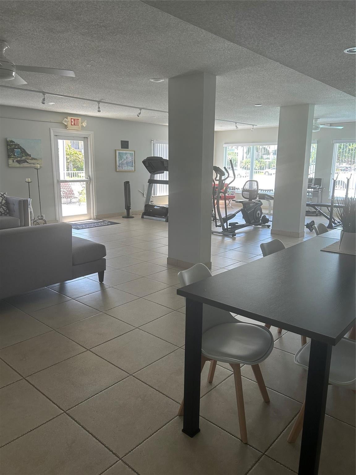 550 Bayshore Drive, #102, Fort Lauderdale, FL 33304 Ceiling fans and lighting, centeral air, security door, couches, tables, chairs, gym equipment, television, radio, pictures, patio area windows view