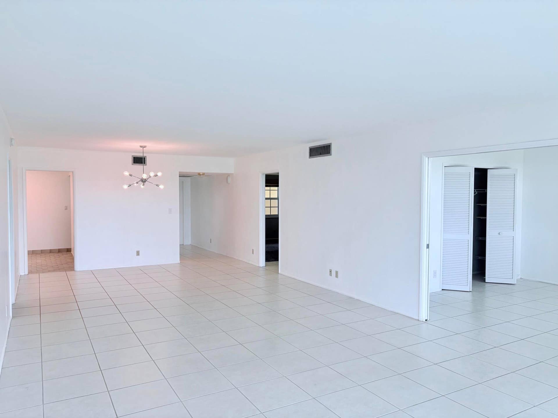 804 Cypress Grove Lane, #508, Pompano Beach, FL 33069 Living area. 3rd bedroom to the right with pocket doors.
