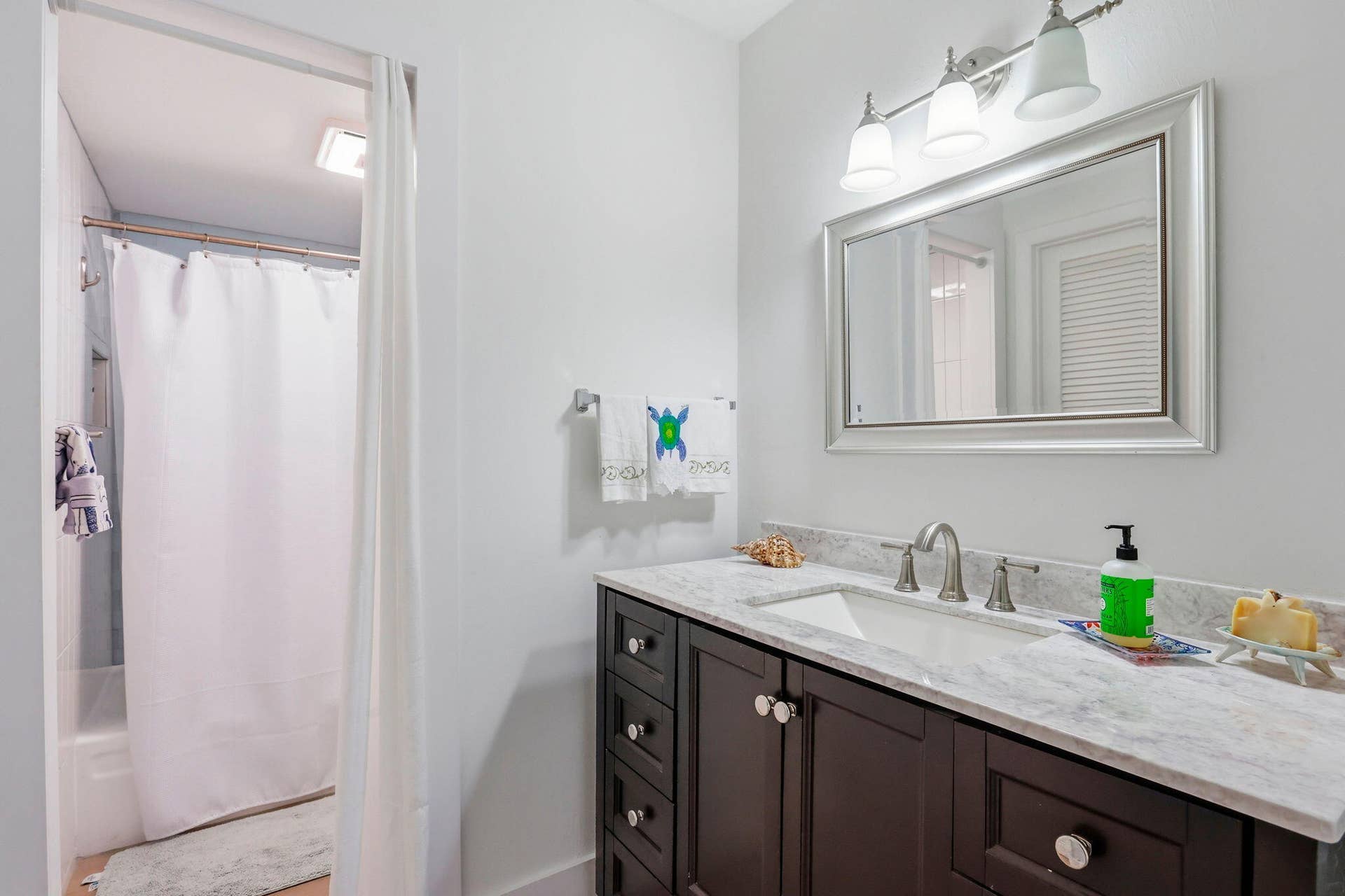 1239 Hillsboro Mile, #302, Hillsboro Beach, FL 33062 Bathroom vanity featuring a light-toned countertop, an undermount sink, and a brushed nickel faucet