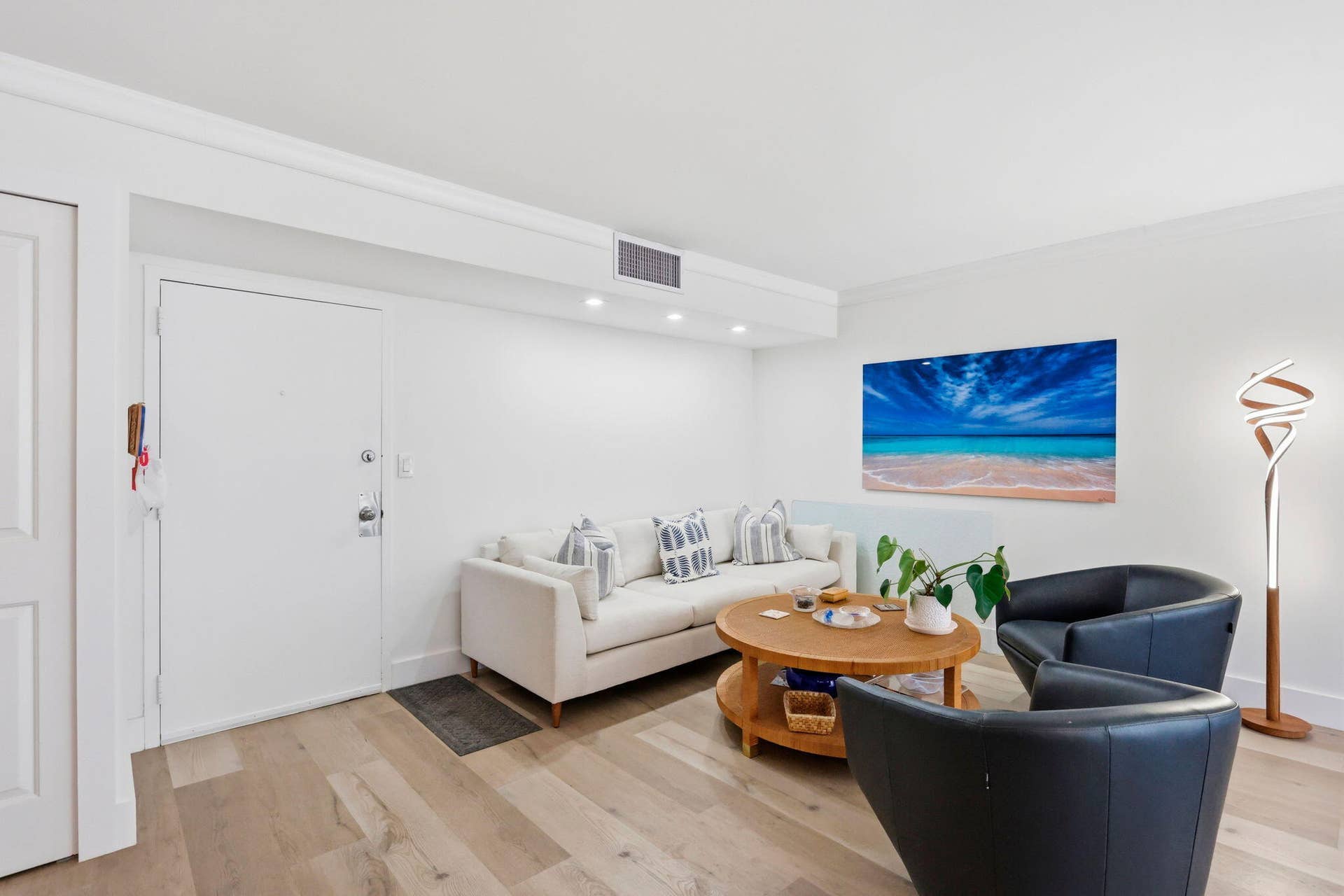 1239 Hillsboro Mile, #302, Hillsboro Beach, FL 33062 Spacious living area featuring luxury vinyl flooring, recessed lighting, and crown molding
