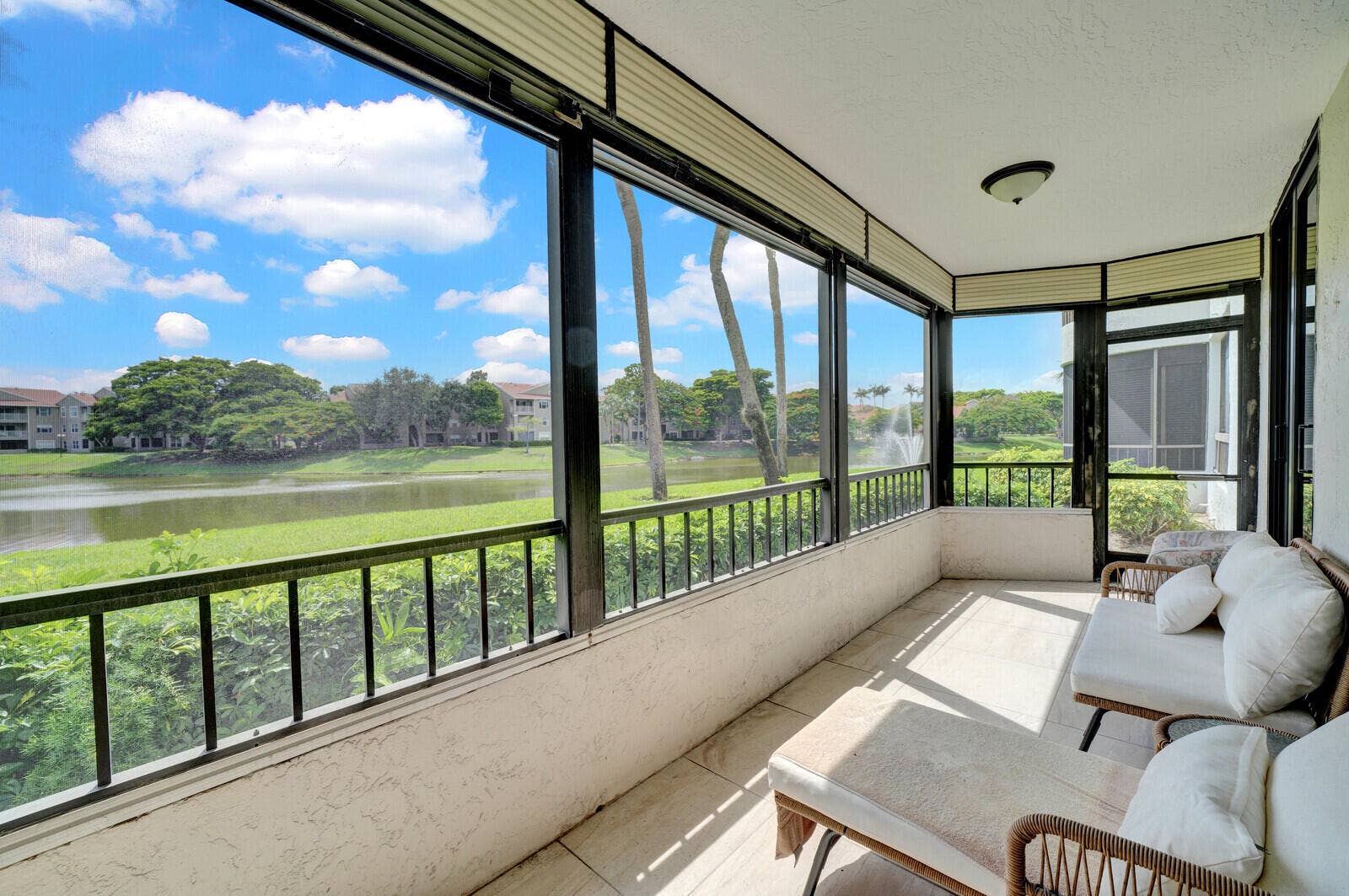 COVERED AND SCREENED PATIO WITH BEAUTIFUL LAKE VIEWS