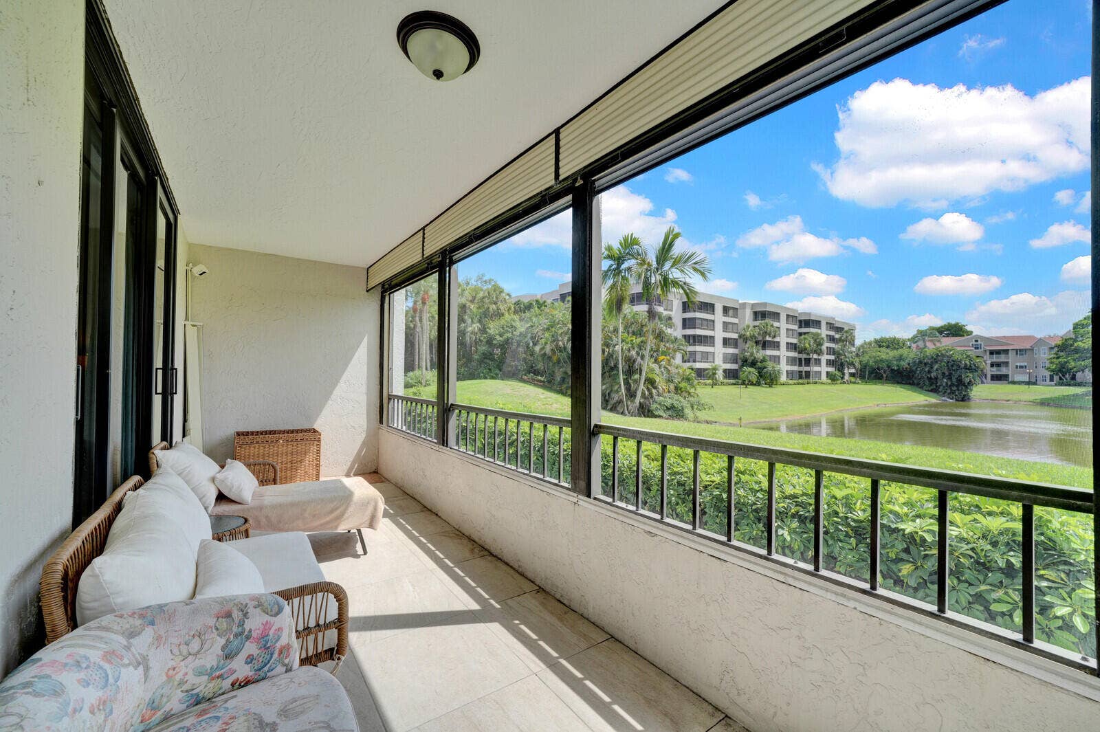 COVERED AND SCREENED PATIO WITH BEAUTIFUL LAKE VIEWS