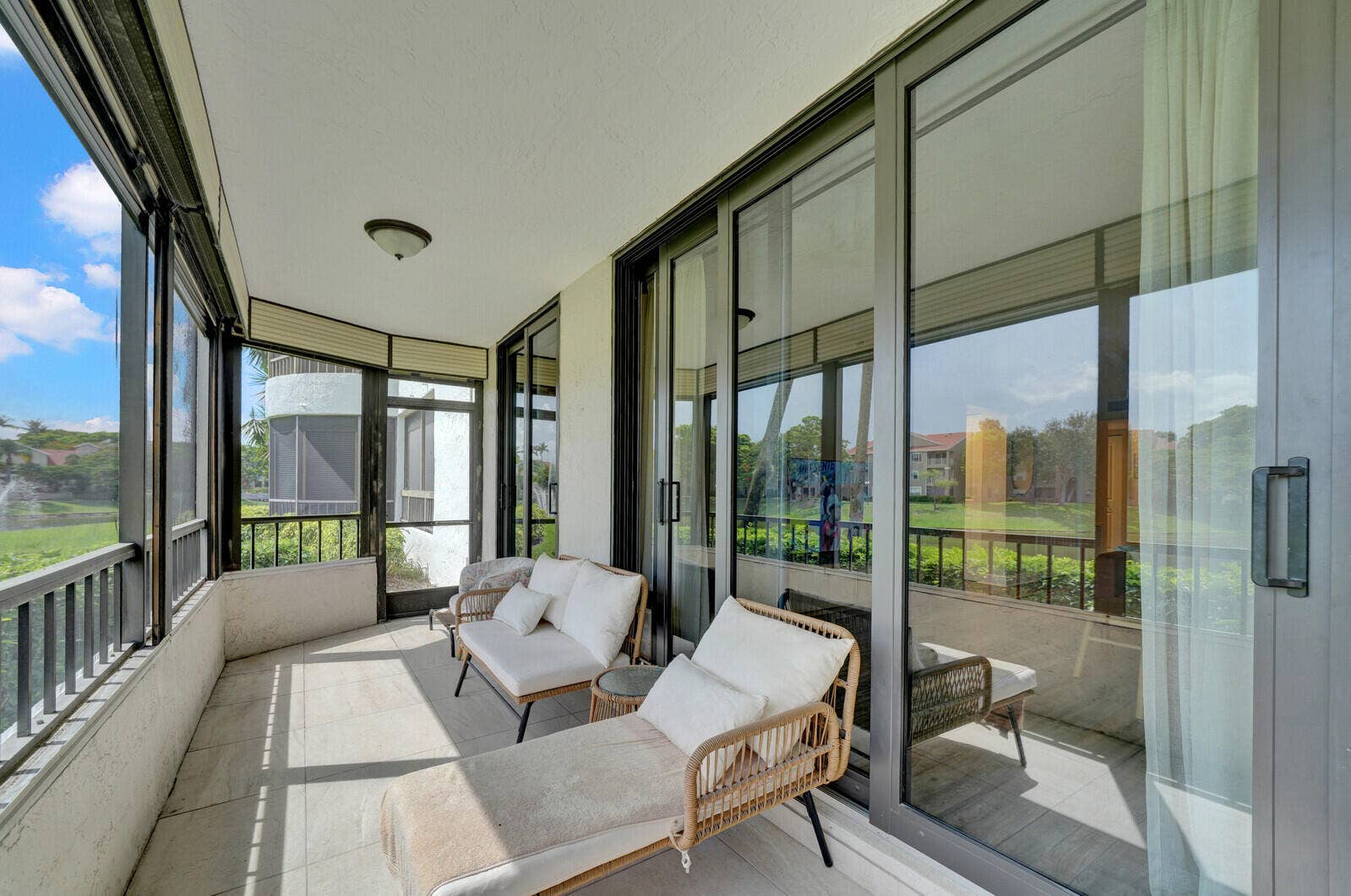 COVERED AND SCREENED PATIO WITH BEAUTIFUL LAKE VIEWS