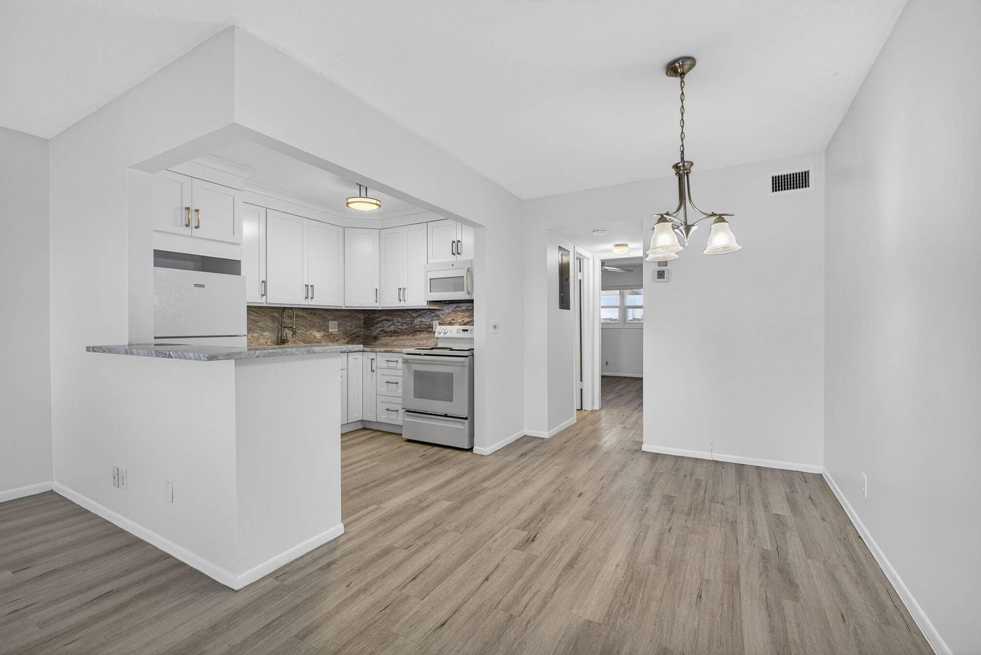 100 Shore Court, #307, North Palm Beach, FL 33408 luxury vinyl flooring throughout